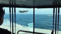 Un avion de chasse atterrit à la verticale sur un porte-avion
