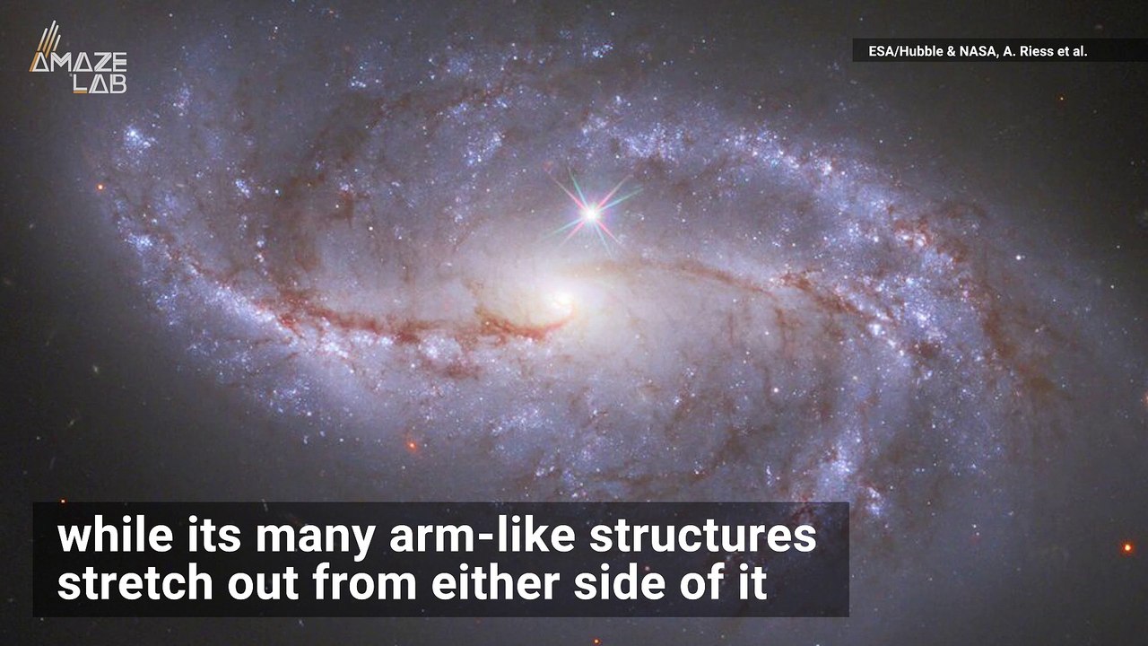 Hubble Captures Arm-Like Structures Sweeping Across Spiral Galaxy