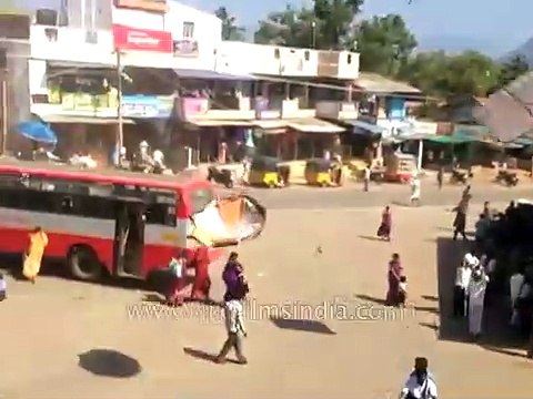 Sudden whirlwind dust devil blows away billboards in India