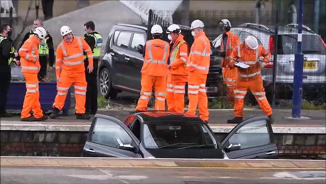 Car stuck on railway track at Stirling railway...