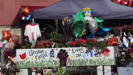 People gather at George Floyd's memorial to celebrate his birthday
