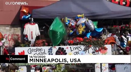 People gather at George Floyd's memorial to mark what would have been his birthday