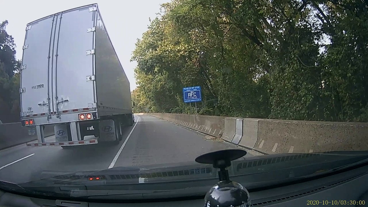 Tailgating Car Swerves into Semi