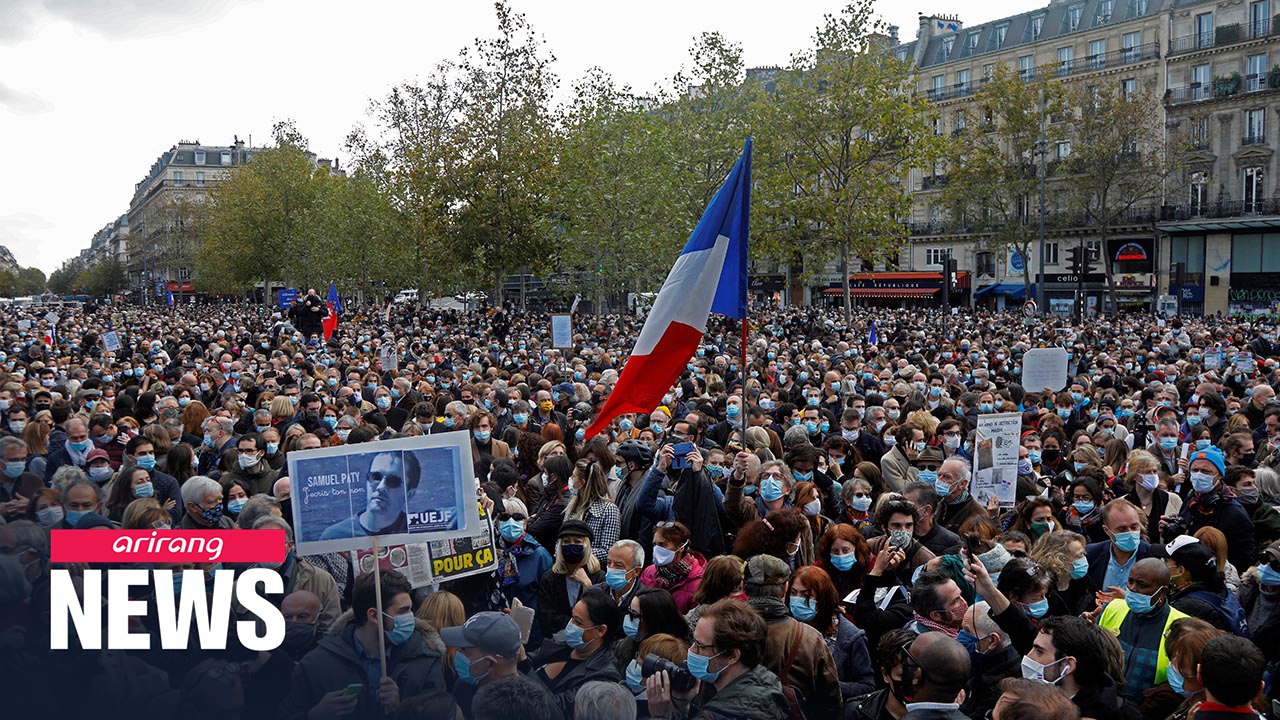 Thousands gather in Paris in memory of murdered teacher
