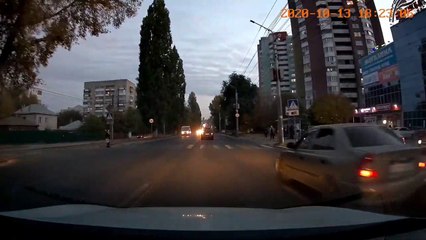 Car Swerves Around Pedestrian at the Last Moment
