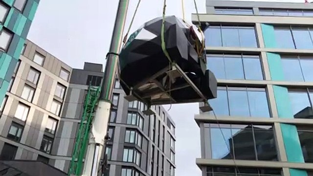 Giant rooftop panda sculpture installed at New Era Square, Sheffield