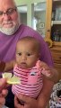 baby makes funny face while tasting lemon for the first time - baby tastes ice cream for first time