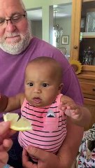 baby makes funny face while tasting lemon for the first time - baby tastes ice cream for first time