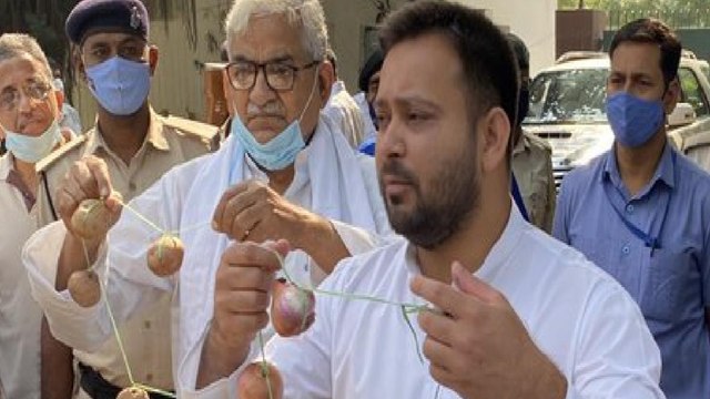 Why Tejashwi is roaming around with Onion garland?