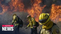 Two wildfires in southern California cause 100,000 evacuees and 2 severely injured fire fighters