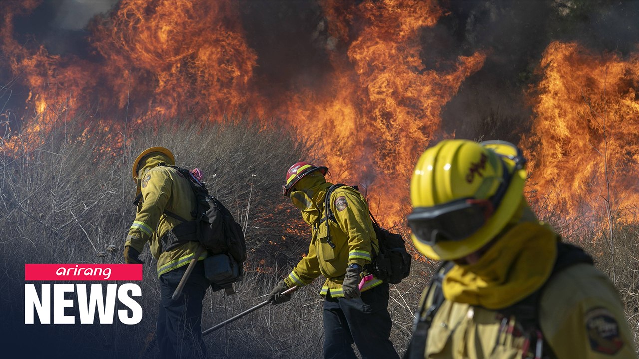 Two wildfires in southern California cause 100,000 evacuees and 2 severely injured fire fighters