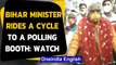 Bihar Polls 2020: Bihar Minister Prem Kumar rides a cycle to a polling booth in Gaya, Watch|Oneindia