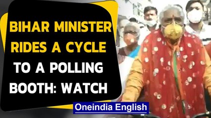 Download Video: Bihar Polls 2020: Bihar Minister Prem Kumar rides a cycle to a polling booth in Gaya, Watch|Oneindia