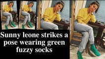 Sunny leone strikes a pose wearing green fuzzy socks