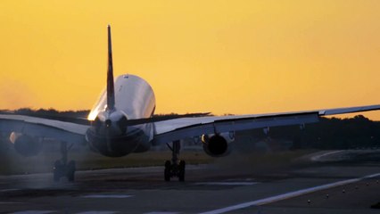 airplane landing in slow motion in a yellow sky