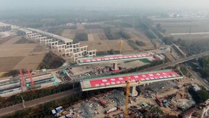 Double-swing bridge spins into place in northern China