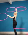 Woman Spins Multiple Hula Hoops Around Body