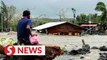 At least 10 dead as typhoon slams Philippines