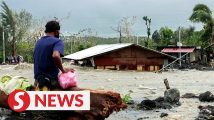 At least 10 dead as typhoon slams Philippines