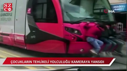 Bursa'da tramvay arkasında tehlikeli yolculuk