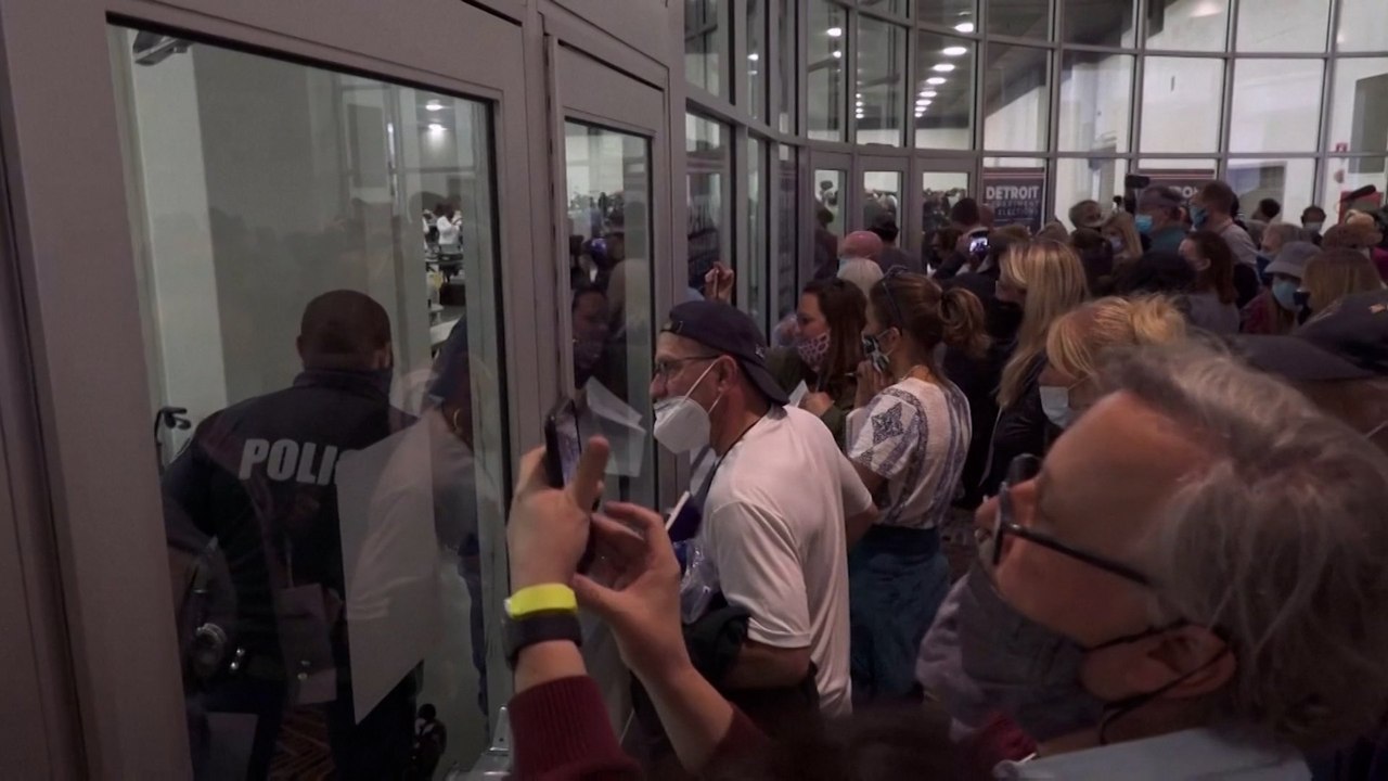 Trump supporters surround Michigan ballot count in Detroit as Biden claims victory