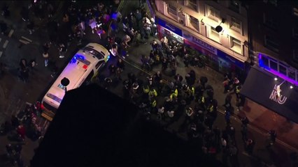 Police move in to shut down nightlife in central London as revellers flock for last night out before lockdown
