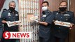 Johor Customs seize cigarettes hidden in plywood doors