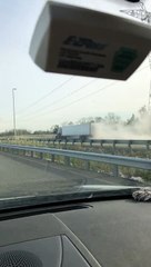 Smoking Semi Continues to Trudge Down Highway