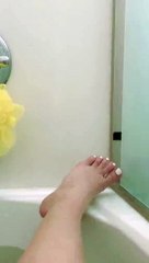 Cute Cat Plays with Person in the Bathtub