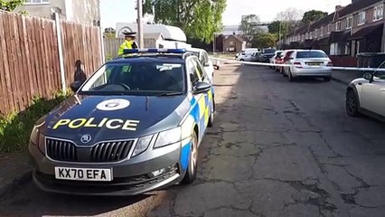 Police cordons remain in place while officers investigate the murder of a 16-year-old boy in Corby