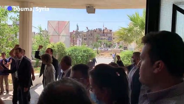 Syrian President Bashar al-Assad and his wife Asma cast their votes in war-torn Douma