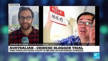 China holds spy trial of Australian writer behind closed doors