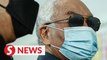 Najib back at 1MDB trial after eye surgery