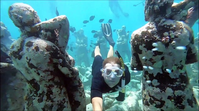 Couple Snorkel Together Through Famous Underwater Statues