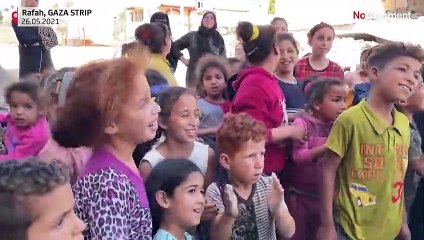 Palestinians dressed as clowns entertain children in Gaza