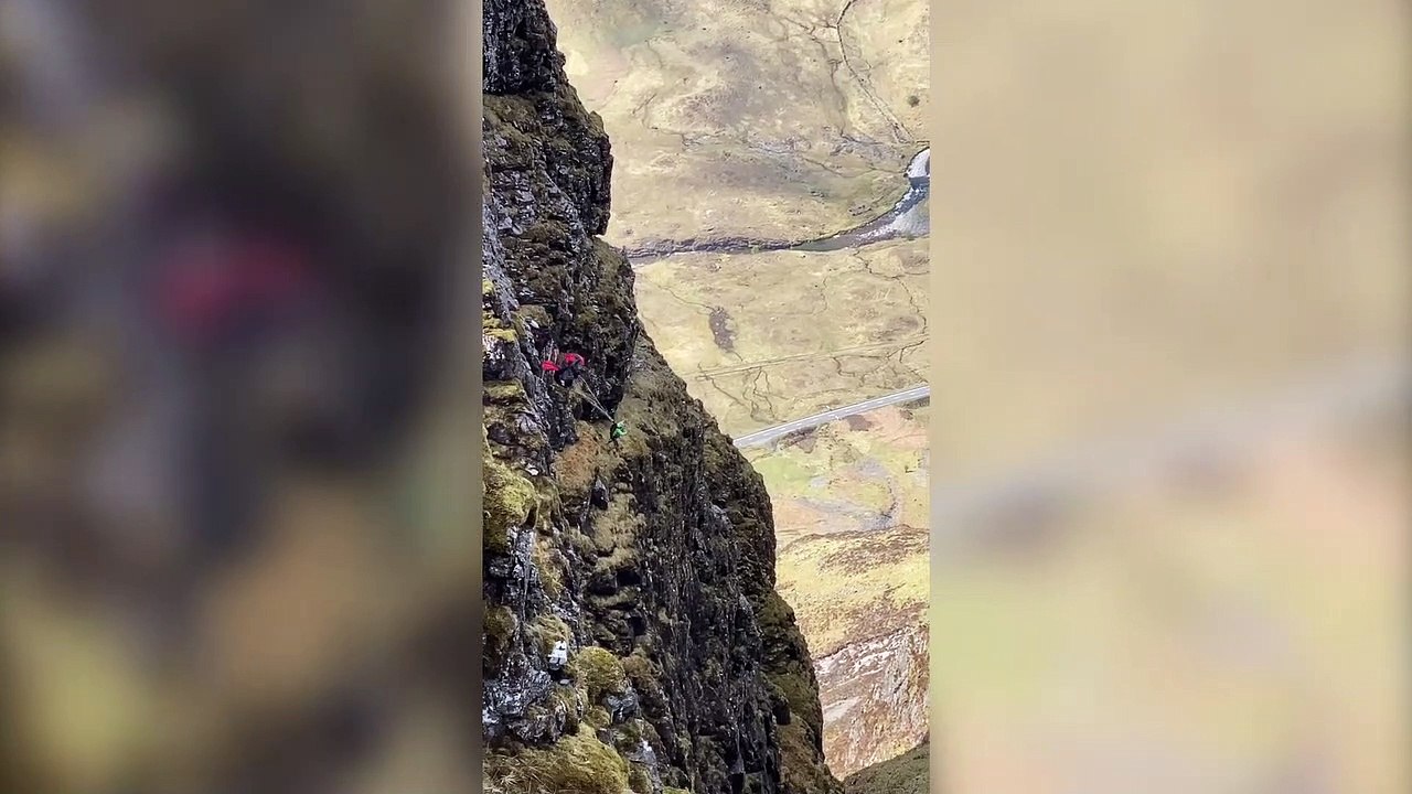 This stunning video shows two daredevils base jumping off the narrowest ridge in the UK in a 'heart in mouth' moment