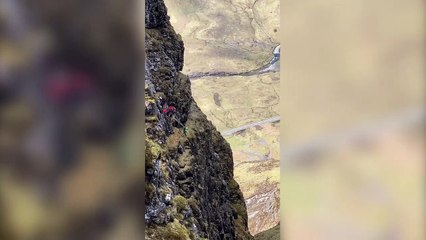 This stunning video shows two daredevils base jumping off the narrowest ridge in the UK in a 'heart in mouth' moment