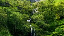 Aerial Drone Shot of Downhill Stream and Waterfall in Glen Coe