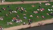 People take advantage of soaring temperatures to hit outdoor pools and beaches in London and Kent