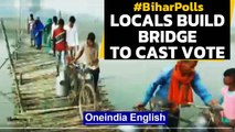 Bihar Polls: Locals build a temporary bridge to reach a polling station in Darbhanga|Oneindia News