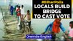 Bihar Polls: Locals build a temporary bridge to reach a polling station in Darbhanga|Oneindia News
