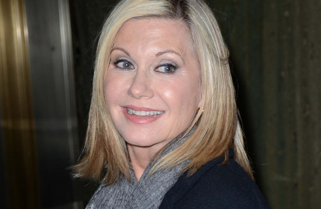 Olivia Newton-John says John Travolta is 'doing...