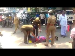 கலெக்டர் அலுவலக சாலையில் படுத்து பெண் போராட்டம்