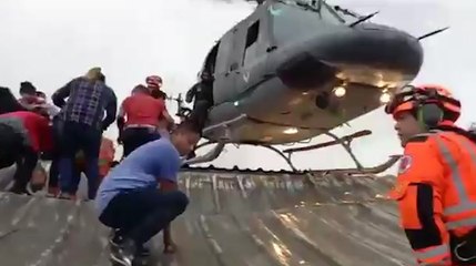 Guatemalans rescued from rooftops during Eta's flooding