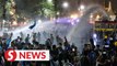 Thai police use water cannon on protesters in Bangkok