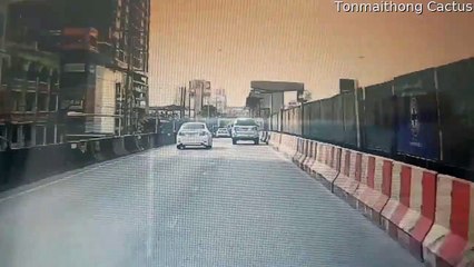 SUV Crashes Through Barricade into Unsuspecting Vehicle