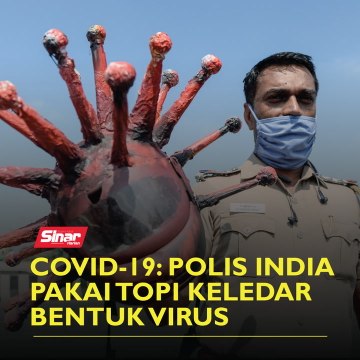 Covid-19: Polis India pakai topi keledar bentuk virus