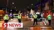 Man crashes car into London police station
