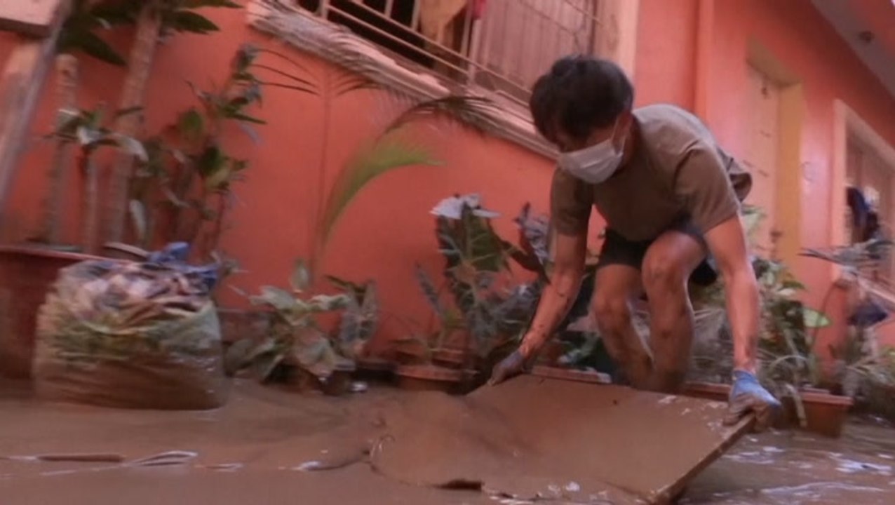 Mud removed from homes after typhoon strikes Philippines