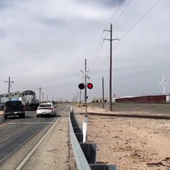 Two Vehicles Nearly Collide with Train and Each Other